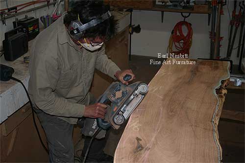 Earl sculpting mesquite slabs for custom made live edge dining table